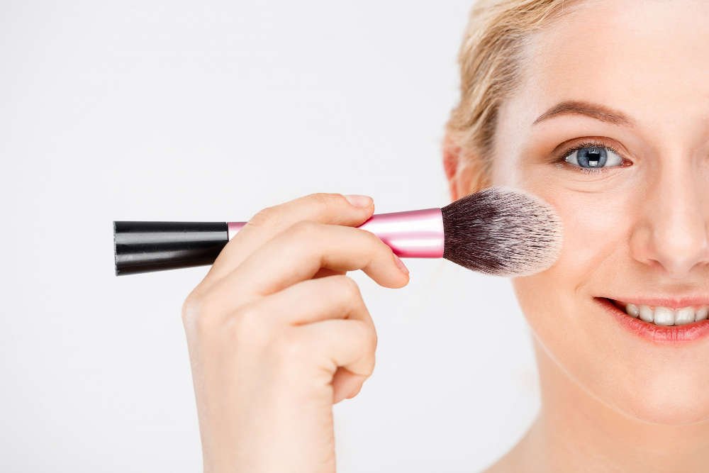woman-apply-makeup-face-with-brush
